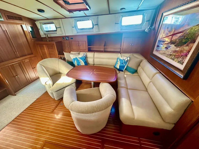 Slide: The Image of Luxurious interior of 2001 Grand Banks 49 Eastbay HX yacht with plush seating and elegant decor. - 19