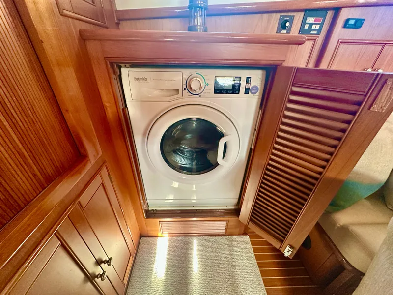 Slide: The Image of Washing machine in 2001 Grand Banks 49 Eastbay HX yacht interior. - 25