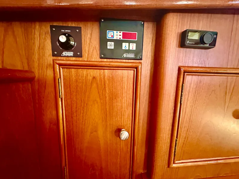 Slide: The Image of Control panel on 2001 Grand Banks 49 Eastbay HX yacht with wooden cabinetry. - 26
