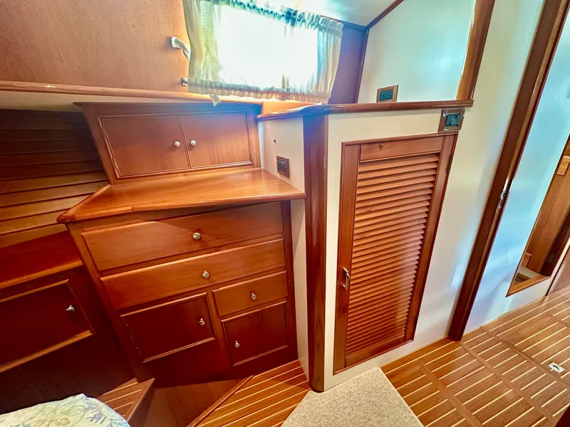Slide: The Image of 2001 Grand Banks 49 Eastbay HX interior with wooden cabinetry and flooring. - 31