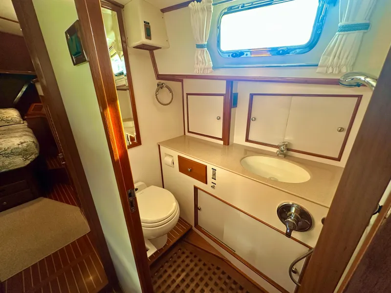 Slide: The Image of Bathroom interior of 2001 Grand Banks 49 Eastbay HX yacht, featuring sink and toilet. - 34