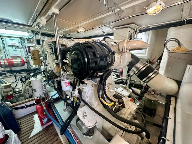 Slide: The Image of Engine room of 2001 Grand Banks 49 Eastbay HX yacht, showcasing mechanical components. - 42