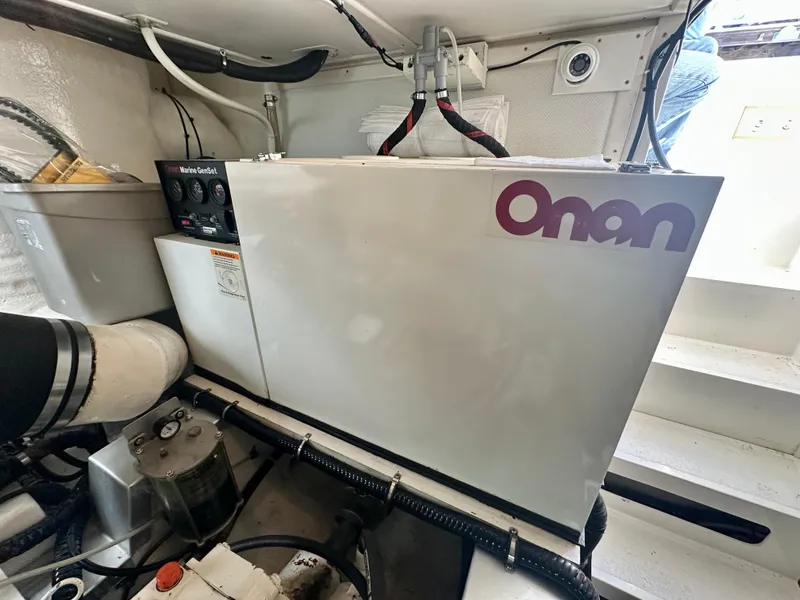 Slide: The Image of Onan generator in 2001 Grand Banks 49 Eastbay HX engine room. - 44