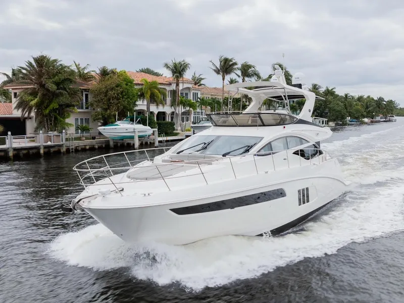 Slide: The Image of 2017 Sea Ray 59 Flybridge yacht cruising on a scenic waterway. - 1