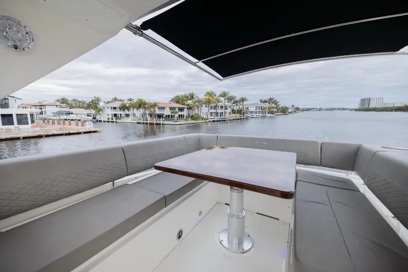 Slide: The Image of 2017 Sea Ray 59 Flybridge yacht with spacious seating and waterfront view. - 10