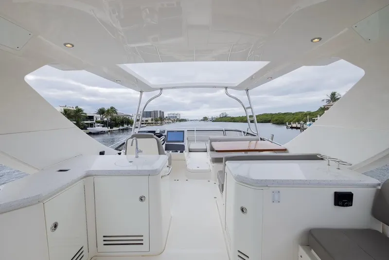 Slide: The Image of Luxurious 2017 Sea Ray 59 Flybridge yacht interior with modern amenities and scenic waterway view. - 11
