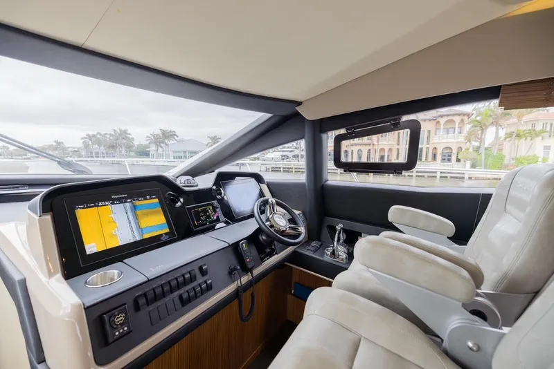 Slide: The Image of Luxurious helm of 2017 Sea Ray 59 Flybridge yacht with advanced navigation systems. - 15