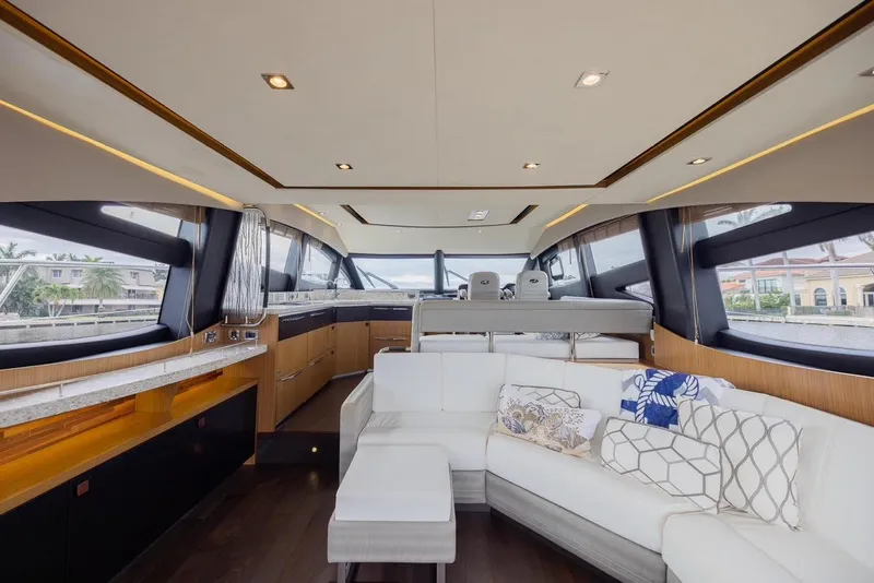 Slide: The Image of Luxurious interior of 2017 Sea Ray 59 Flybridge yacht with modern seating and panoramic windows. - 16