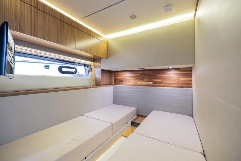 Slide: The Image of Interior cabin of 2017 Sea Ray 59 Flybridge yacht with modern design and twin beds. - 28