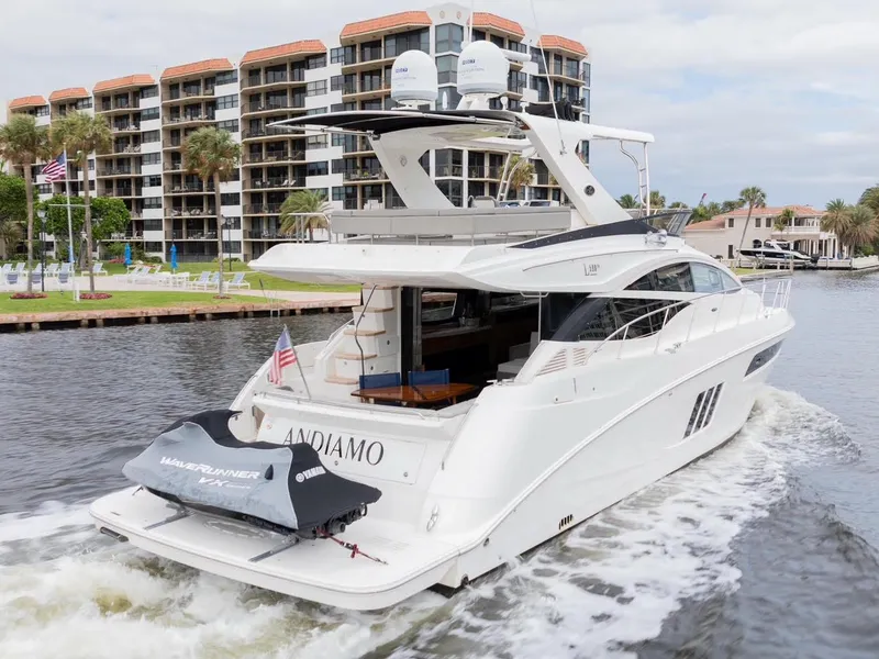 Slide: The Image of 2017 Sea Ray 59 Flybridge yacht cruising near waterfront buildings. - 4