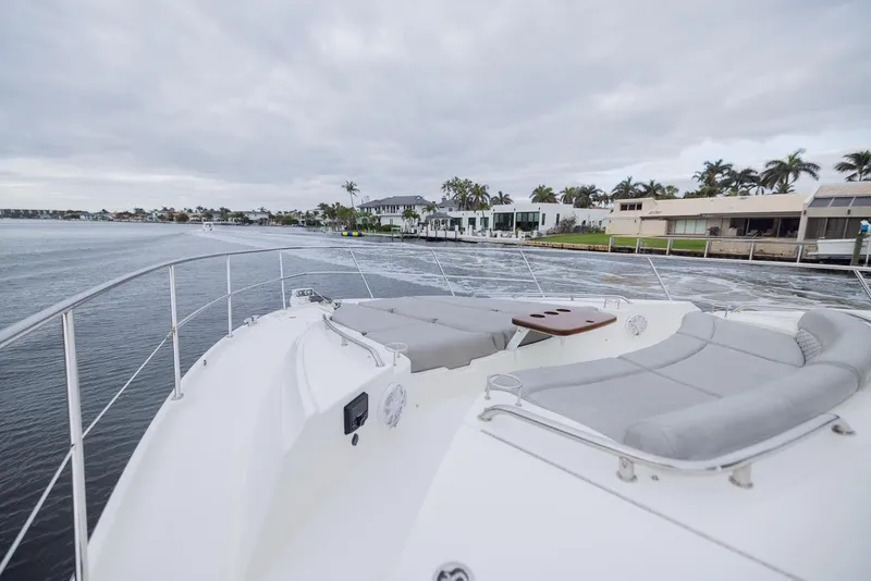 Slide: The Image of 2017 Sea Ray 59 Flybridge yacht with spacious deck and waterfront view. - 6