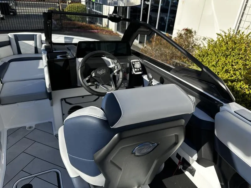 Slide: The Image of 2025 Malibu Wakesetter 23 LSV interior with modern dashboard and steering wheel. - 10