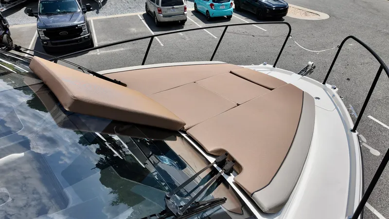 Slide: The Image of 2025 Bayliner Trophy 29 Explorer with sunpad, parked in a lot. - 10