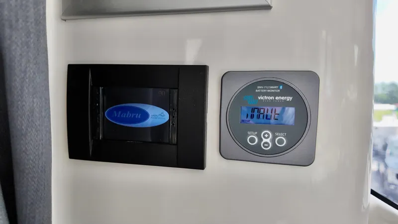 Slide: The Image of Control panel of 2025 Bayliner Trophy 29 Explorer with Mabru and Victron Energy displays. - 15