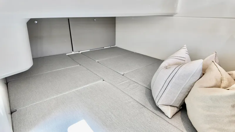 Slide: The Image of Interior cabin of 2025 Bayliner Trophy 29 Explorer with cushions and pillows. - 17