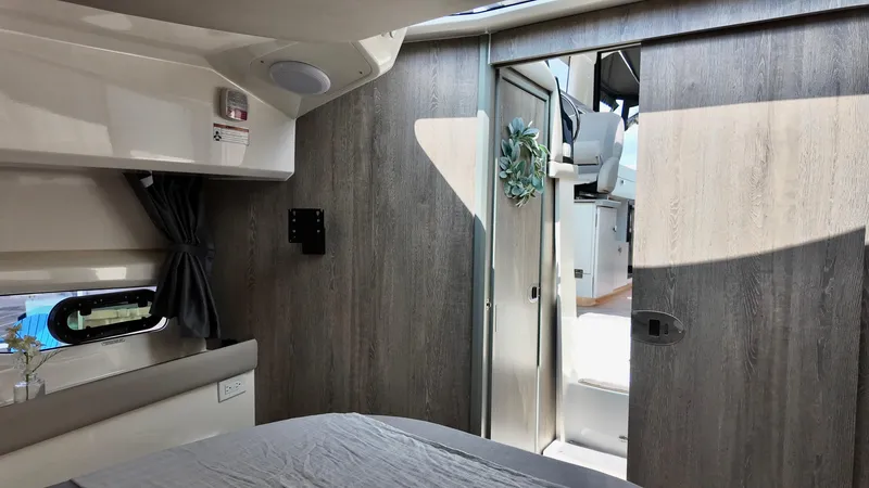 Slide: The Image of Interior of 2025 Bayliner Trophy 29 Explorer, featuring modern design and natural light. - 25