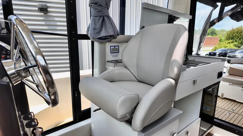 Slide: The Image of Captain's chair in 2025 Bayliner Trophy 29 Explorer boat cockpit. - 28
