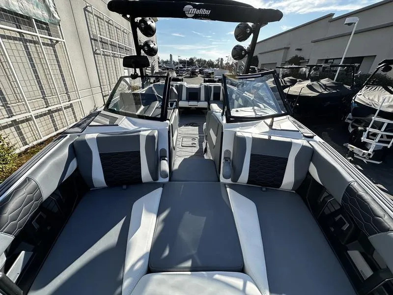 Slide: The Image of 2025 Malibu Wakesetter 24 MXZ interior, showcasing sleek seating and modern design. - 9