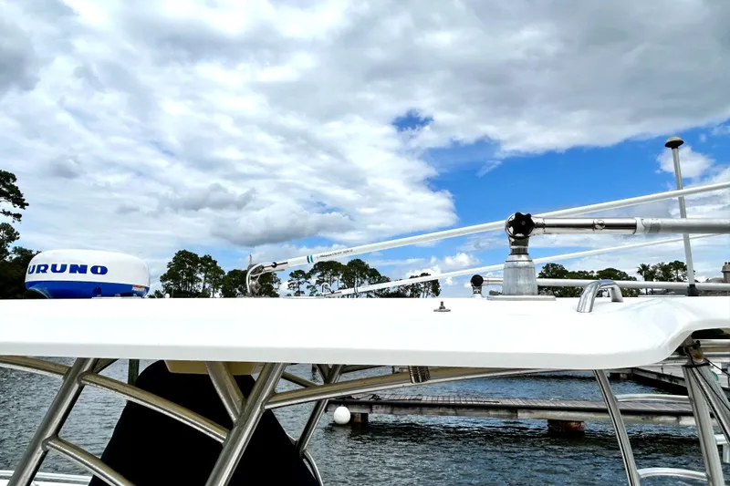 Slide: The Image of 2008 World Cat 330 TE boat with radar, docked under cloudy sky. - 14
