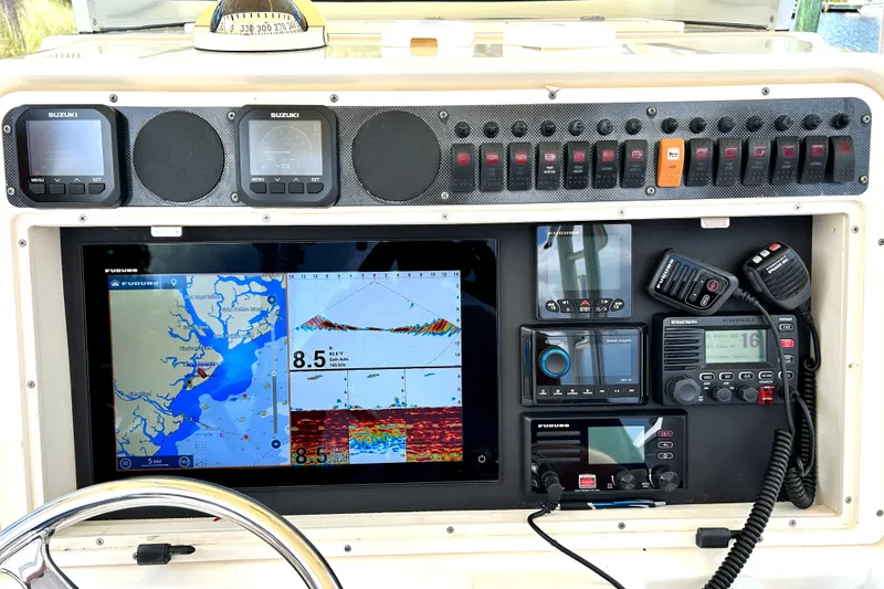 Slide: The Image of Control panel of a 2008 World Cat 330 TE boat with navigation and communication equipment. - 18