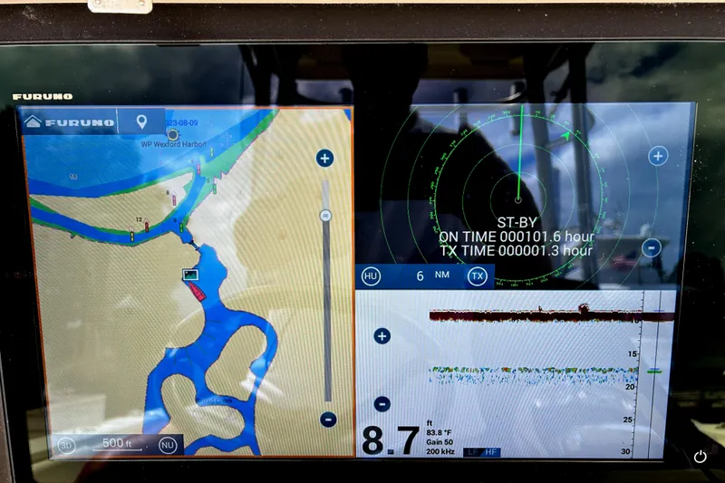 Slide: The Image of Navigation display on a 2008 World Cat 330 TE boat, showing radar and map data. - 20