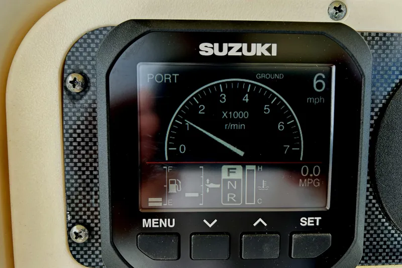 Slide: The Image of Suzuki boat dashboard display on 2008 World Cat 330 TE, showing speed and RPM. - 22