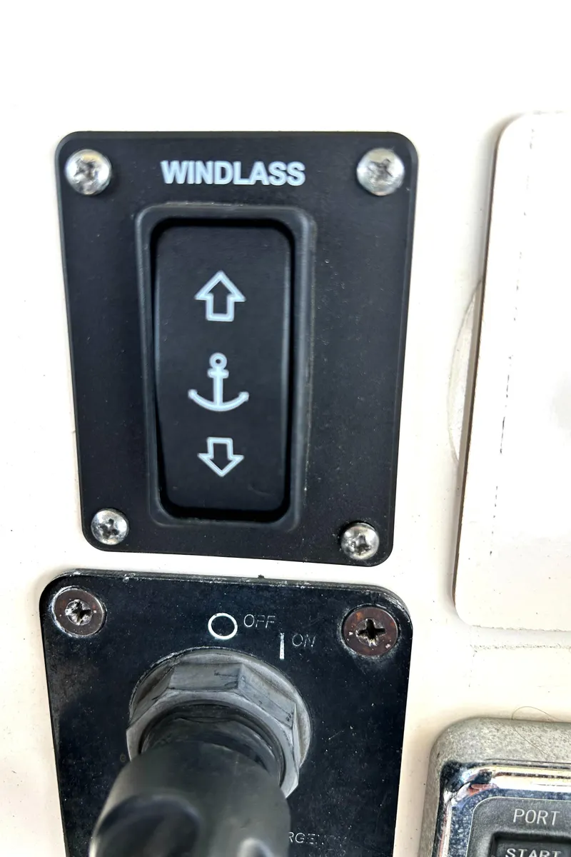 Slide: The Image of Windlass control switch on 2008 World Cat 330 TE boat dashboard. - 23