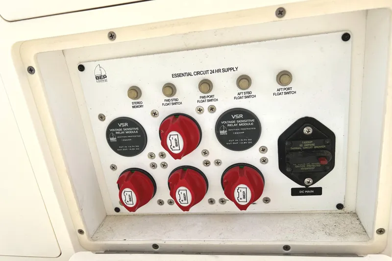 Slide: The Image of Control panel of a 2008 World Cat 330 TE boat, featuring essential circuit switches. - 26