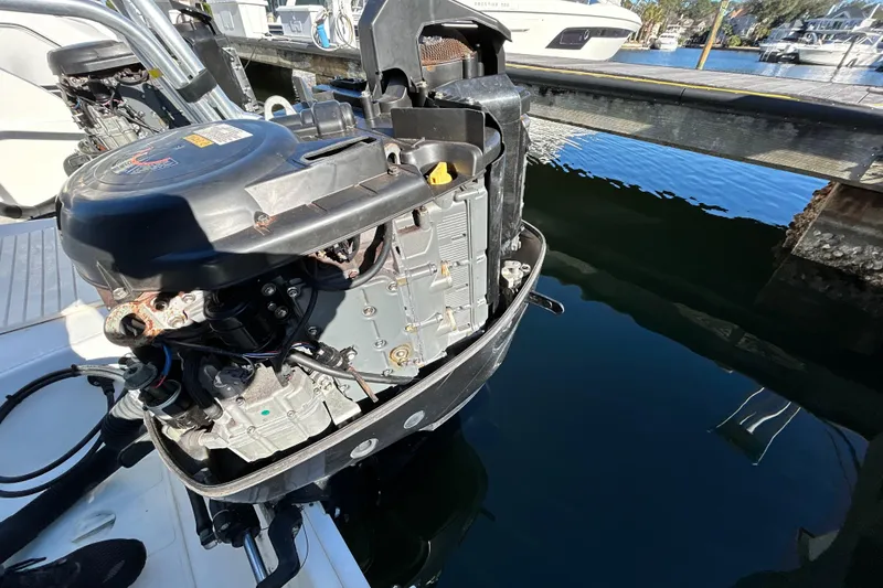 Slide: The Image of Outboard motor of a 2008 World Cat 330 TE boat at a marina. - 30