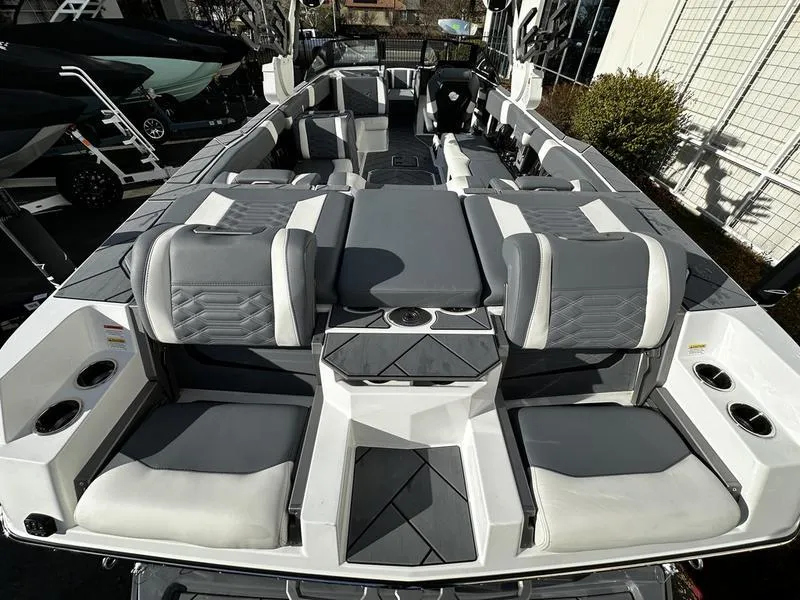 Slide: The Image of 2025 Malibu Wakesetter 26 LSV boat interior with gray and white seating. - 4