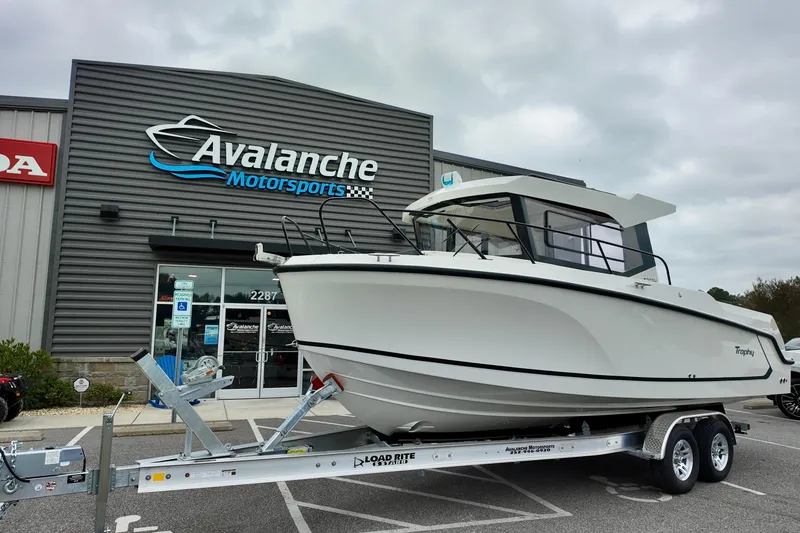 The Image of 2026 Bayliner Trophy T25 Pilothouse boat on trailer at Avalanche Motorsports. - 2
