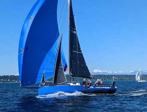 Slide: The Image of Sailing yacht Offshore Racing Van Munster Boats Fred Barrett 35, 2016, with blue sails on open water. - 13