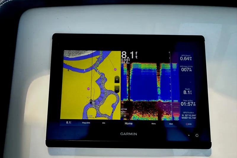 Slide: The Image of Garmin marine display on 2020 Grady-White Freedom 275 boat, showing navigation and sonar data. - 10