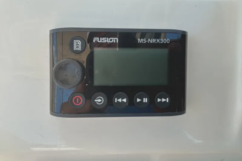 Slide: The Image of Fusion MS-NRX300 marine stereo remote on a Grady-White Freedom 275, 2020 model. - 12