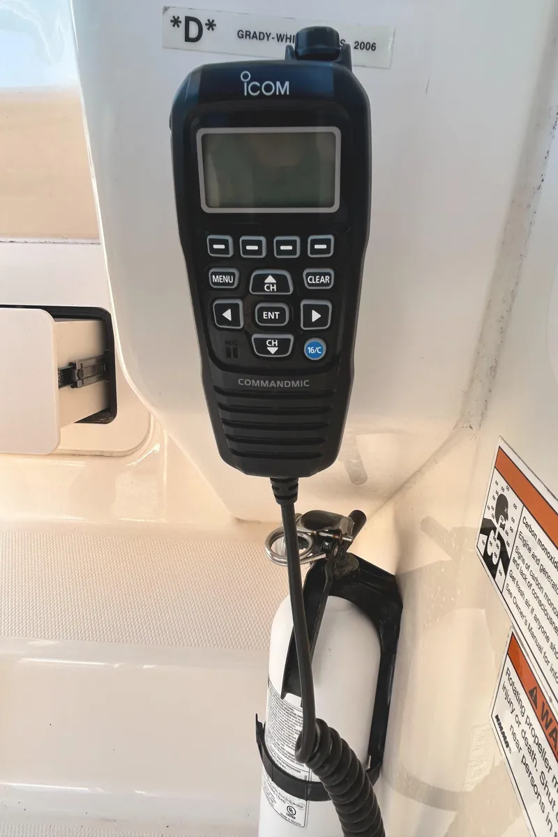 Slide: The Image of ICOM marine radio on 2020 Grady-White Freedom 275 boat dashboard. - 13