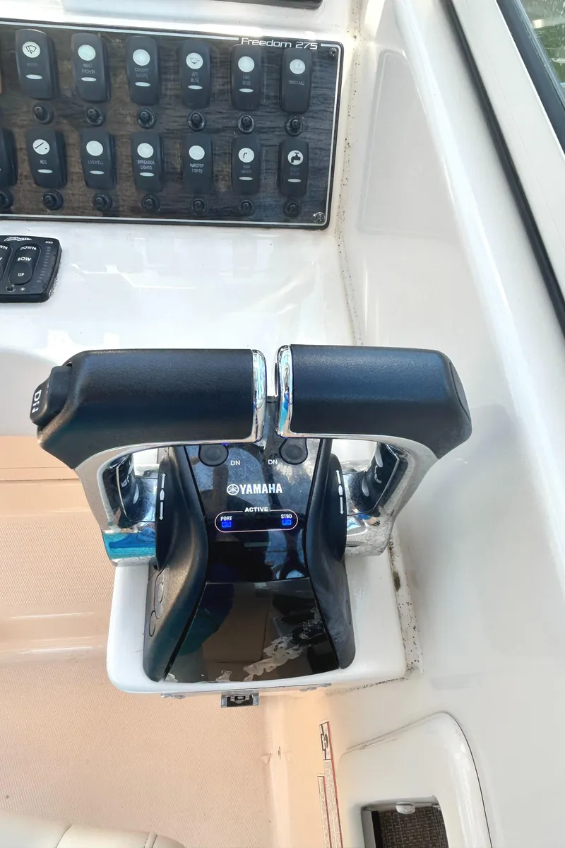 Slide: The Image of 2020 Grady-White Freedom 275 boat controls with Yamaha throttle system. - 14