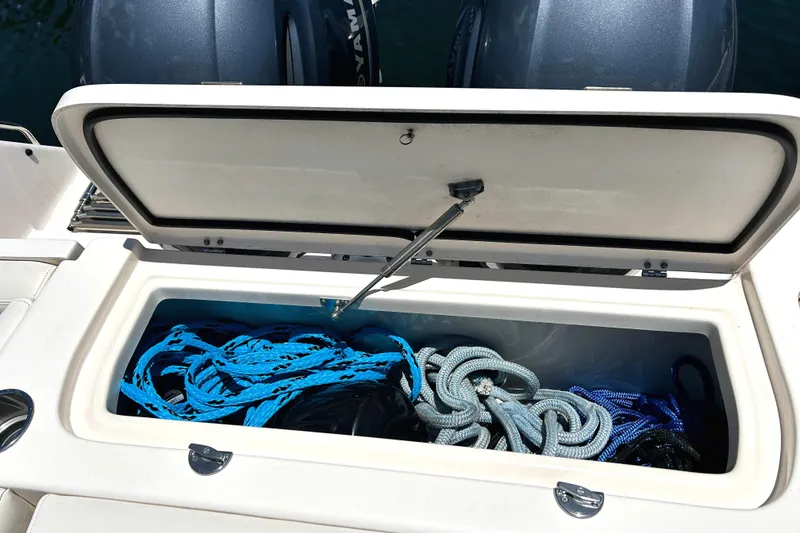 Slide: The Image of Storage compartment on 2020 Grady-White Freedom 275 boat with ropes inside. - 20