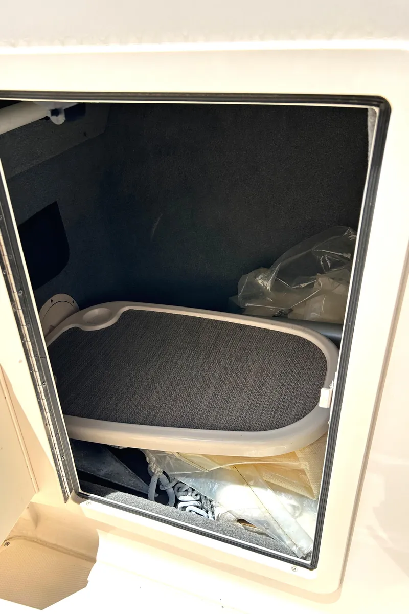 Slide: The Image of Storage compartment in a 2020 Grady-White Freedom 275 boat. - 27