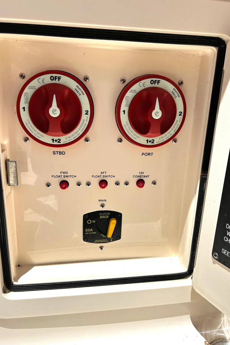 Slide: The Image of Control panel of a 2020 Grady-White Freedom 275 boat with switches and dials. - 29