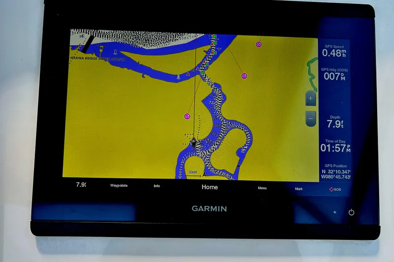 Slide: The Image of Garmin navigation display on 2020 Grady-White Freedom 275 boat, showing detailed waterway map. - 9