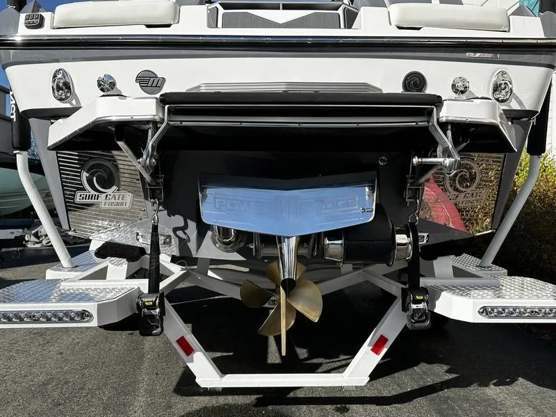 Slide: The Image of 2025 Malibu M230 boat stern with propeller and surf gate system. - 2