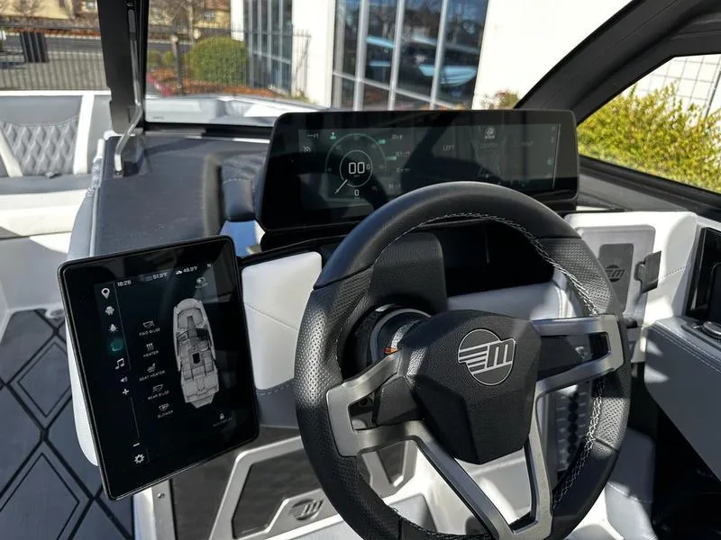 Slide: The Image of 2025 Malibu M230 dashboard with digital displays and modern steering wheel. - 6