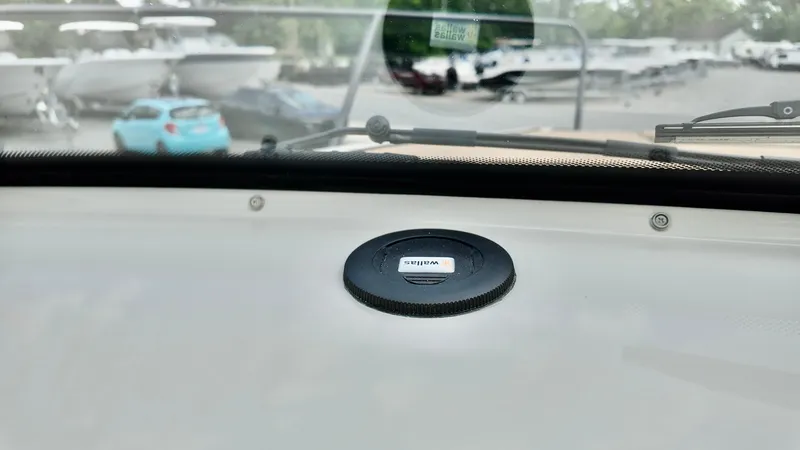 Slide: The Image of Dashboard view of 2025 Bayliner TROPHY 25 EXPLORER with marina background. - 7