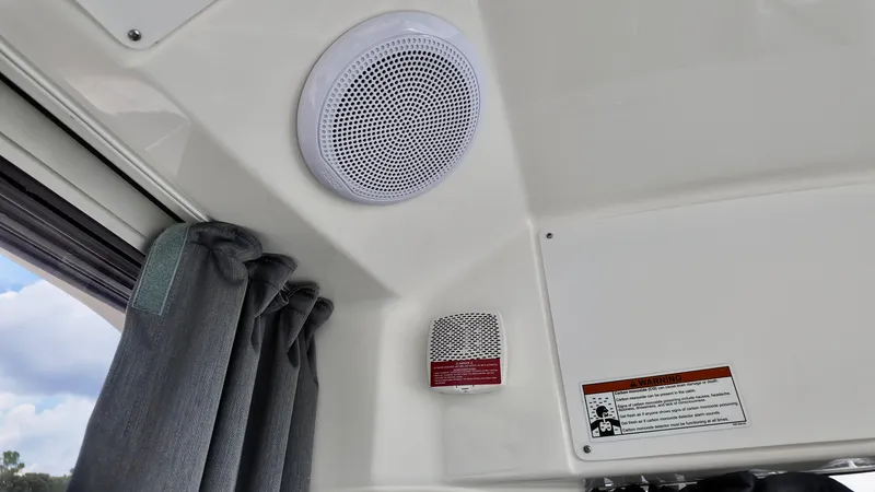 Slide: The Image of Interior of 2025 Bayliner TROPHY 25 EXPLORER with speaker and safety equipment. - 9