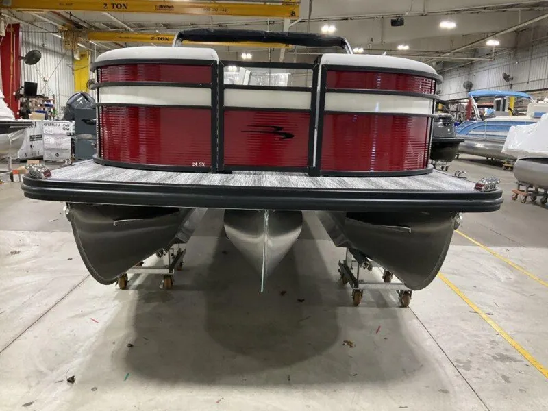 Slide: The Image of 2025 Bennington 24 SXSB pontoon boat in a warehouse, rear view. - 13