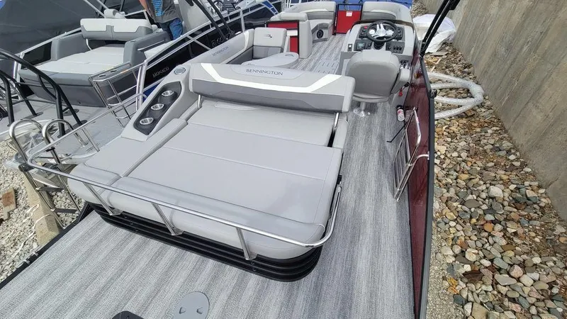 Slide: The Image of 2025 Bennington 24 SXSB pontoon boat with spacious seating and modern design. - 4