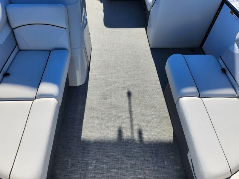 Slide: The Image of 2022 Crest Classic LX 200 interior with gray carpet and white seating. - 10