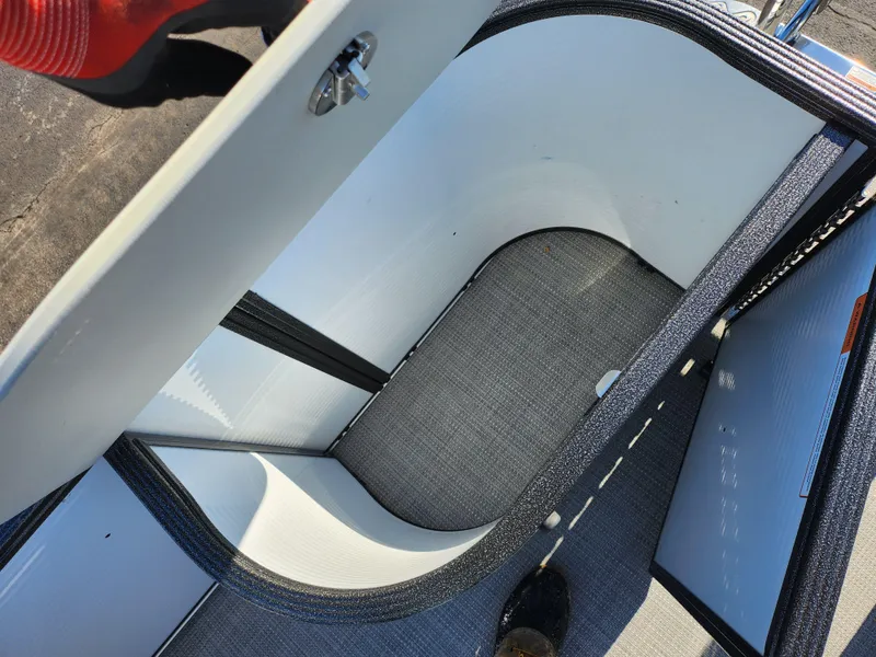 Slide: The Image of Storage compartment of 2022 Crest Classic LX 200 boat, open and empty. - 16