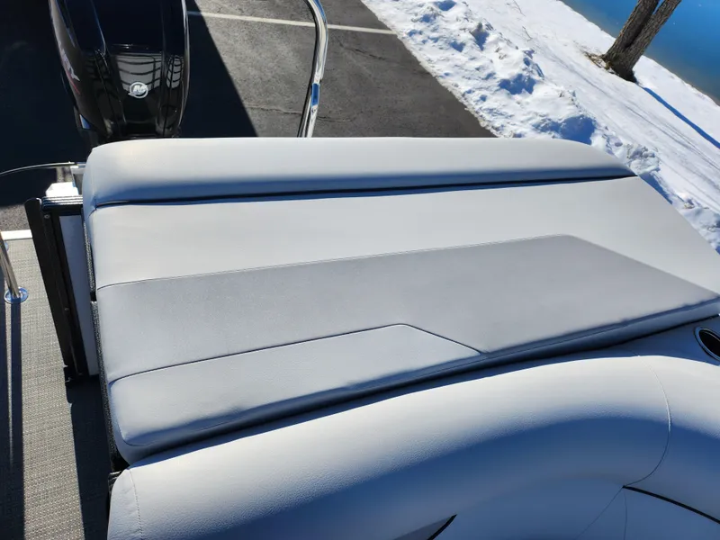 Slide: The Image of 2022 Crest Classic LX 200 boat seat with sleek gray upholstery, parked near snowy landscape. - 17