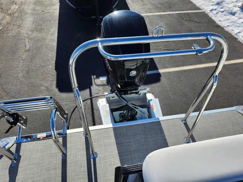Slide: The Image of 2022 Crest Classic LX 200 boat with outboard motor and chrome railings. - 19